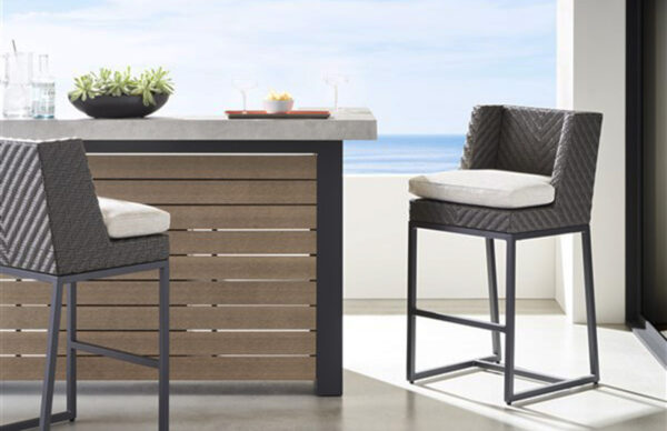 Modern patio furniture with ocean view background