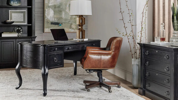 Elegant home office with vintage desk and chair.