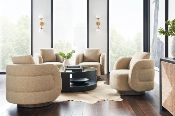 Modern living room with beige chairs and table.