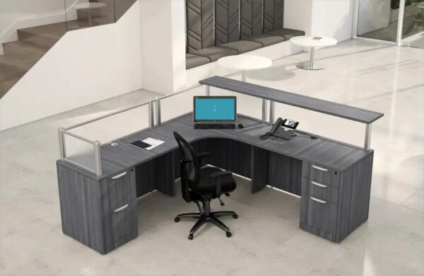 Modern reception desk with chair and computer setup.