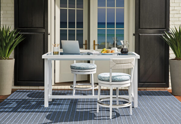 Outdoor patio desk overlooking ocean view.