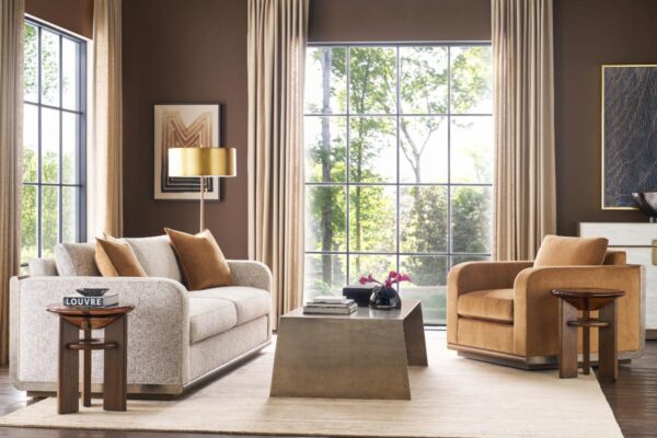 Modern living room with beige furniture and large window.