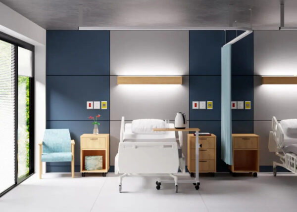 Modern hospital room with bed and chairs.