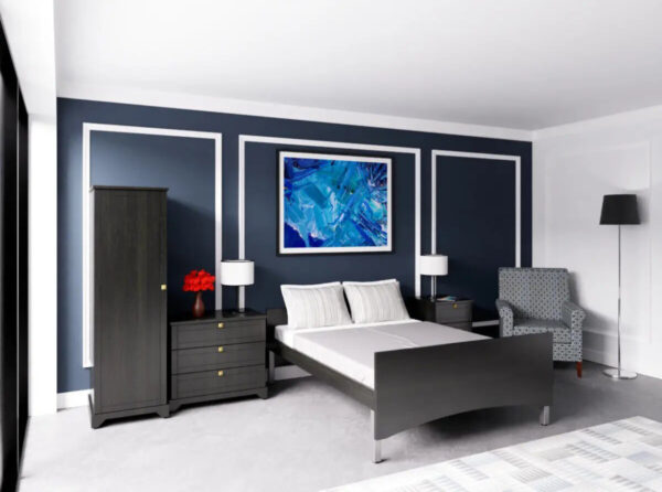 Modern bedroom with dark furniture and blue artwork.