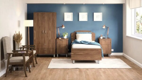 Modern bedroom with blue accent wall and wooden furniture.