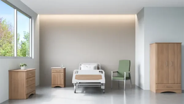 Modern hospital room with bed and furniture.