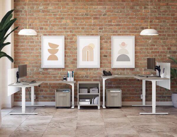 Modern office with desks and abstract artwork.