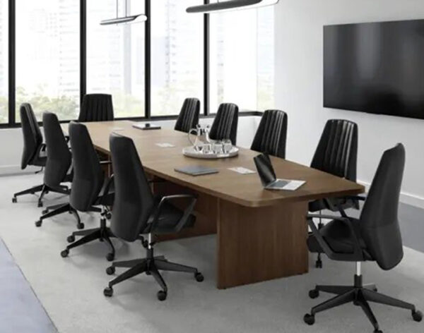 Modern conference room with large table and chairs.