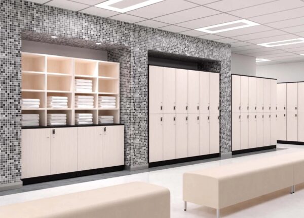 Modern locker room with benches and towels.