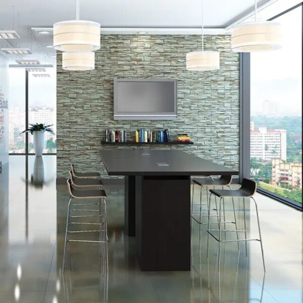 Modern office meeting room with stone wall.