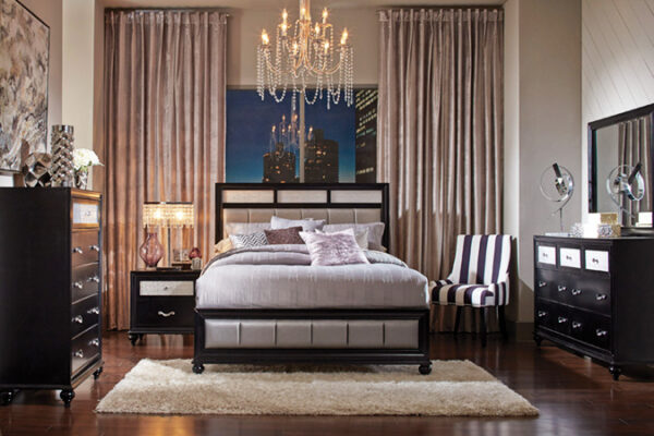 Elegant bedroom with chandelier and cityscape backdrop