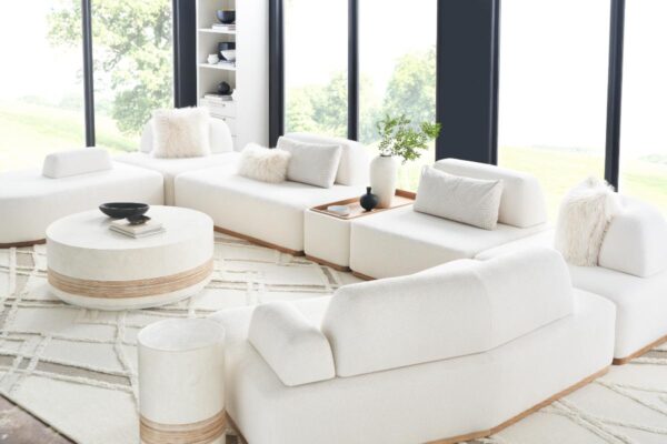 Modern white living room with plush couches.