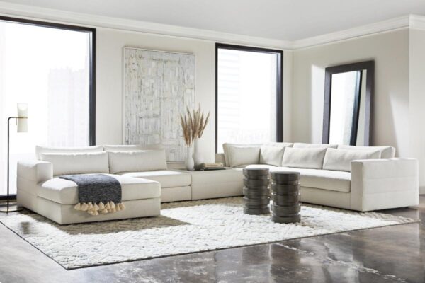 Modern living room with white sectional sofa.