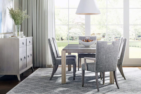 Modern dining room with elegant table and chairs.