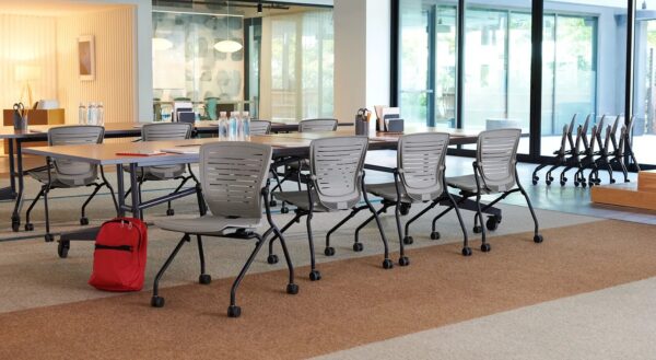 Modern conference room with chairs and tables setup.