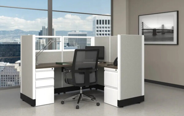 Modern office cubicle with city view window.