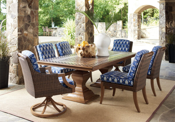 Outdoor dining set with blue cushioned chairs