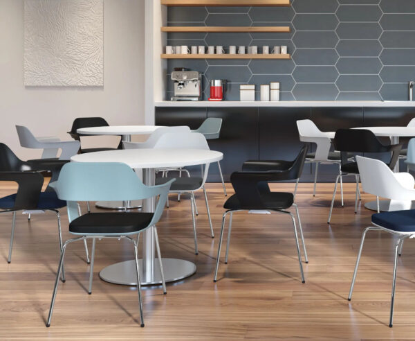 Modern cafe interior with tables and chairs.