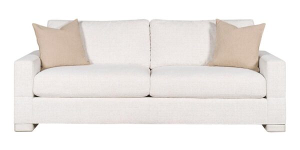 White sofa with beige pillows, modern style