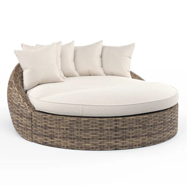 Round wicker patio lounger with cushions