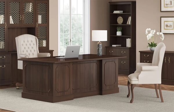 Elegant home office with wooden desk and chairs.